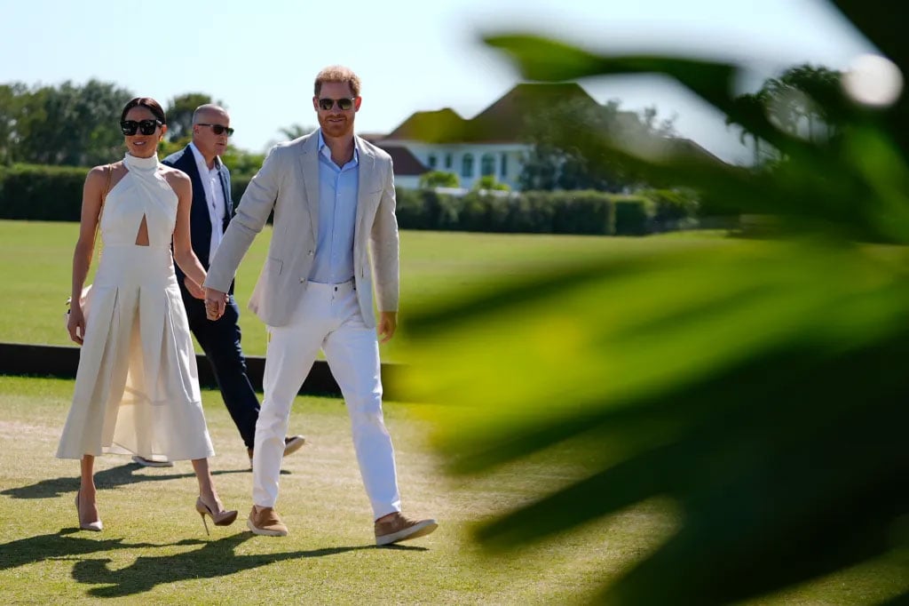 Prince Harry kisses Meghan Markle after bagging a polo win in Florida 