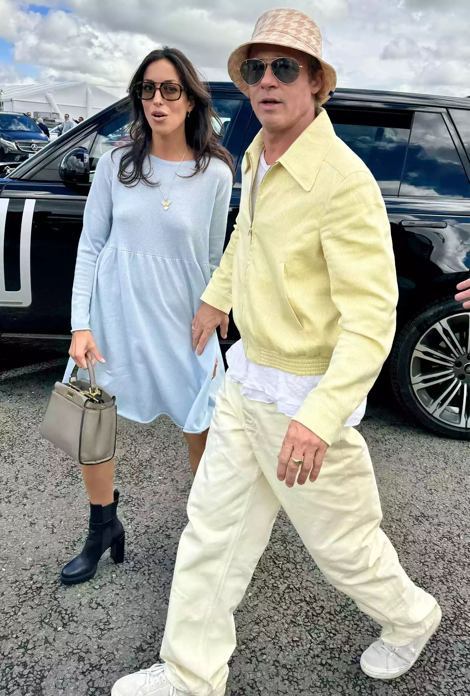 Brad Pitt, girlfriend Ines de Ramon walk hand-in-hand at the British Grand Prix