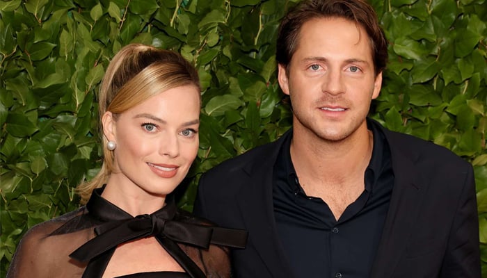 Margot Robbie flaunts baby bump at Wimbledon