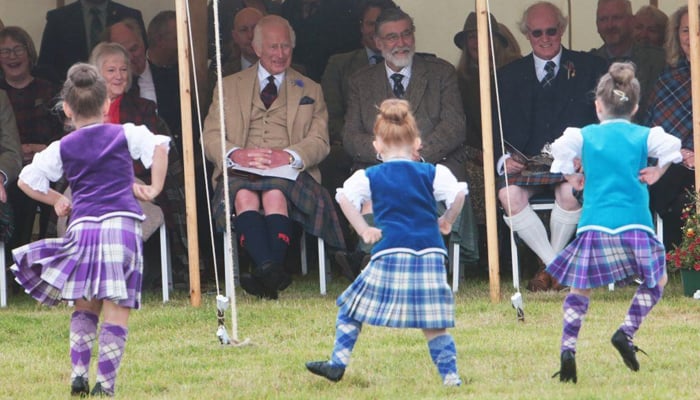 King Charles entertained by young female dancers in Scotland