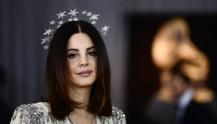 iLana Del Rey sparks dating rumors after she is spotted holding hands at the Leeds Festival
