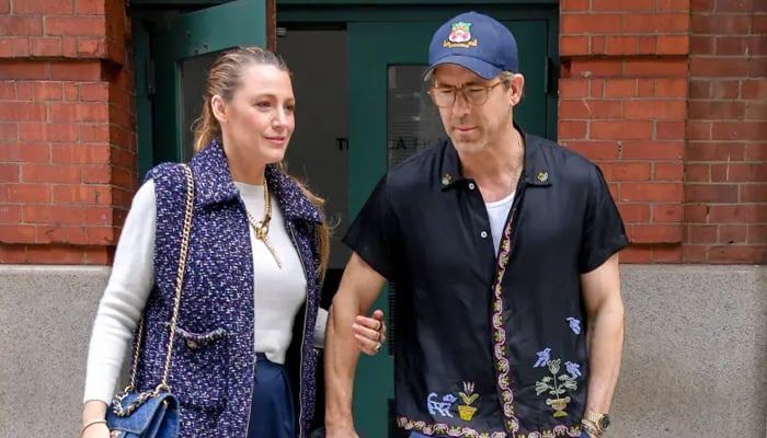 Ryan Reynolds added some pop to his blue and white clothing while Blake Lively stuck to the code