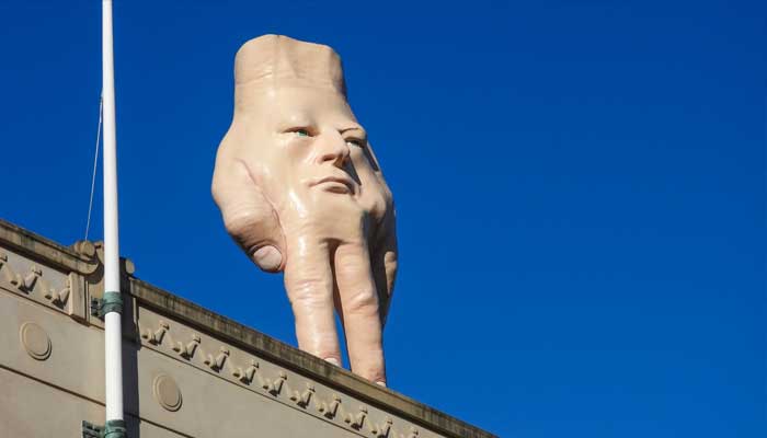 ?Why controversial giant hand is being removed from a New Zealand building