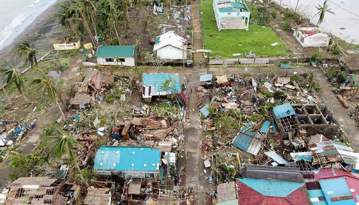 Typhoon Man-yi damaged nearly 8,000 homes and left over 100 cities and towns without power