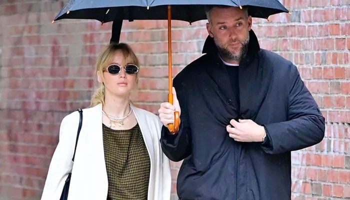 Photo: BACKGRID Jennifer Lawrence glows in chic maternity outfit during rainy day stroll