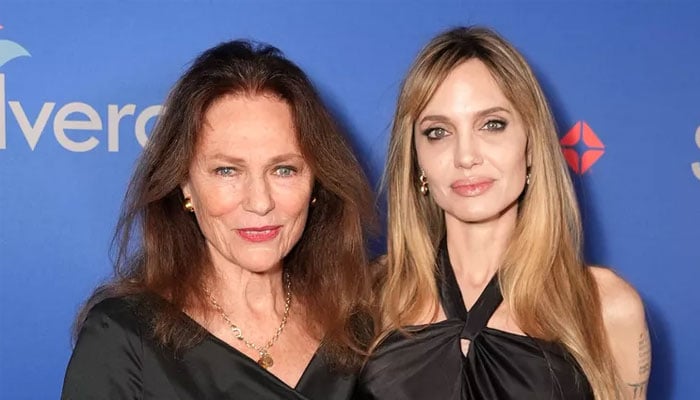 Angelina Jolie’s godmother Jacqueline Bisset presents her award at Palm Springs Film Festival