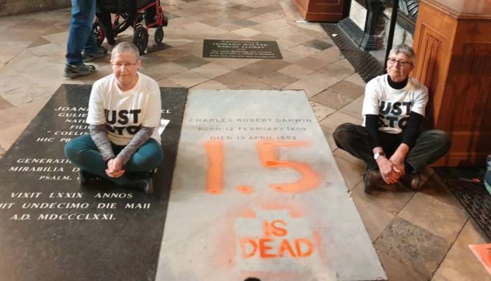 Two women arrested after defacing Charles Darwins grave in climate protest