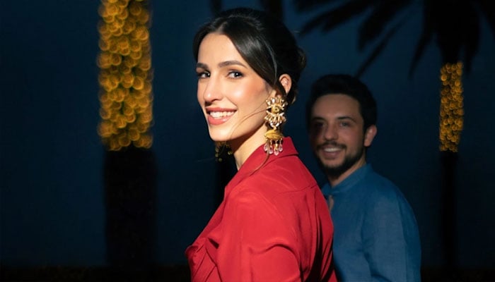 Princess Rajwa of Jordan looks regal in raspberry-hued dress during royal ceremony