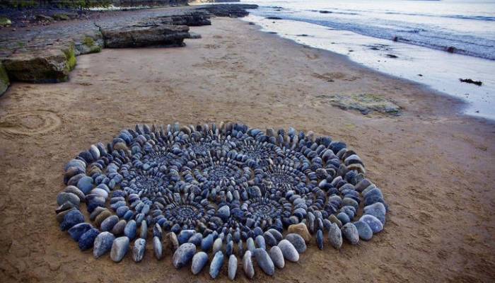 Mysterious artist behind stunning beach stone art finally revealed