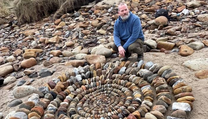 Mysterious artist behind stunning beach stone art finally revealed