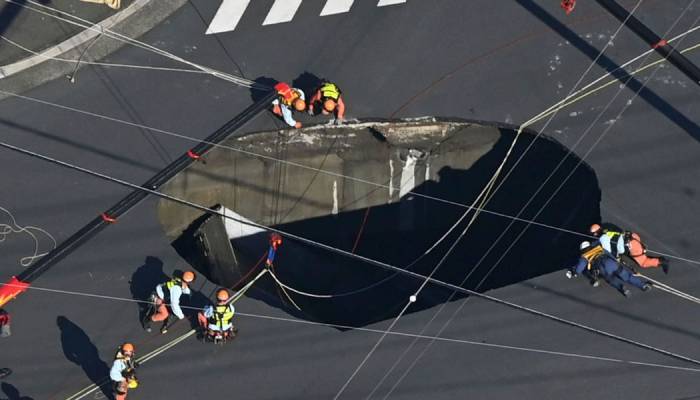 Massive sinkhole swallows truck at busy intersection in Japan