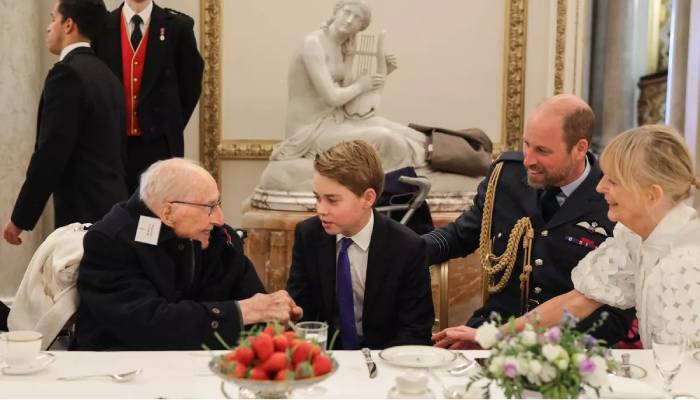 Prince George wins over veterans with his charming presence at VE Day tea party