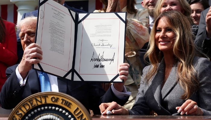 Melania Trump joins US president to sign anti-revenge porn bill