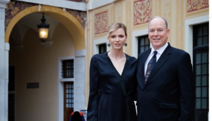 Prince Albert II, Princess Charlene grace palace courtyard for Monaco Grand Prix event