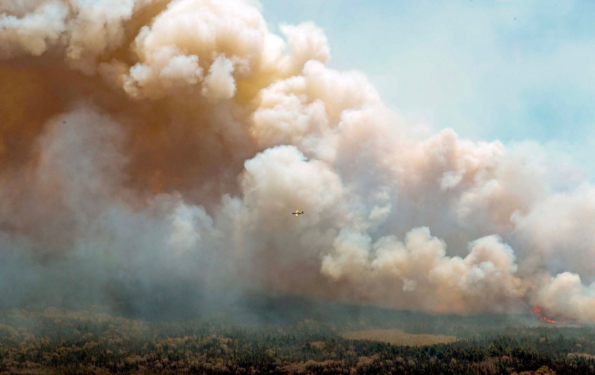 Canadian wildfire crisis forces thousands to flee as smoke spreads to US