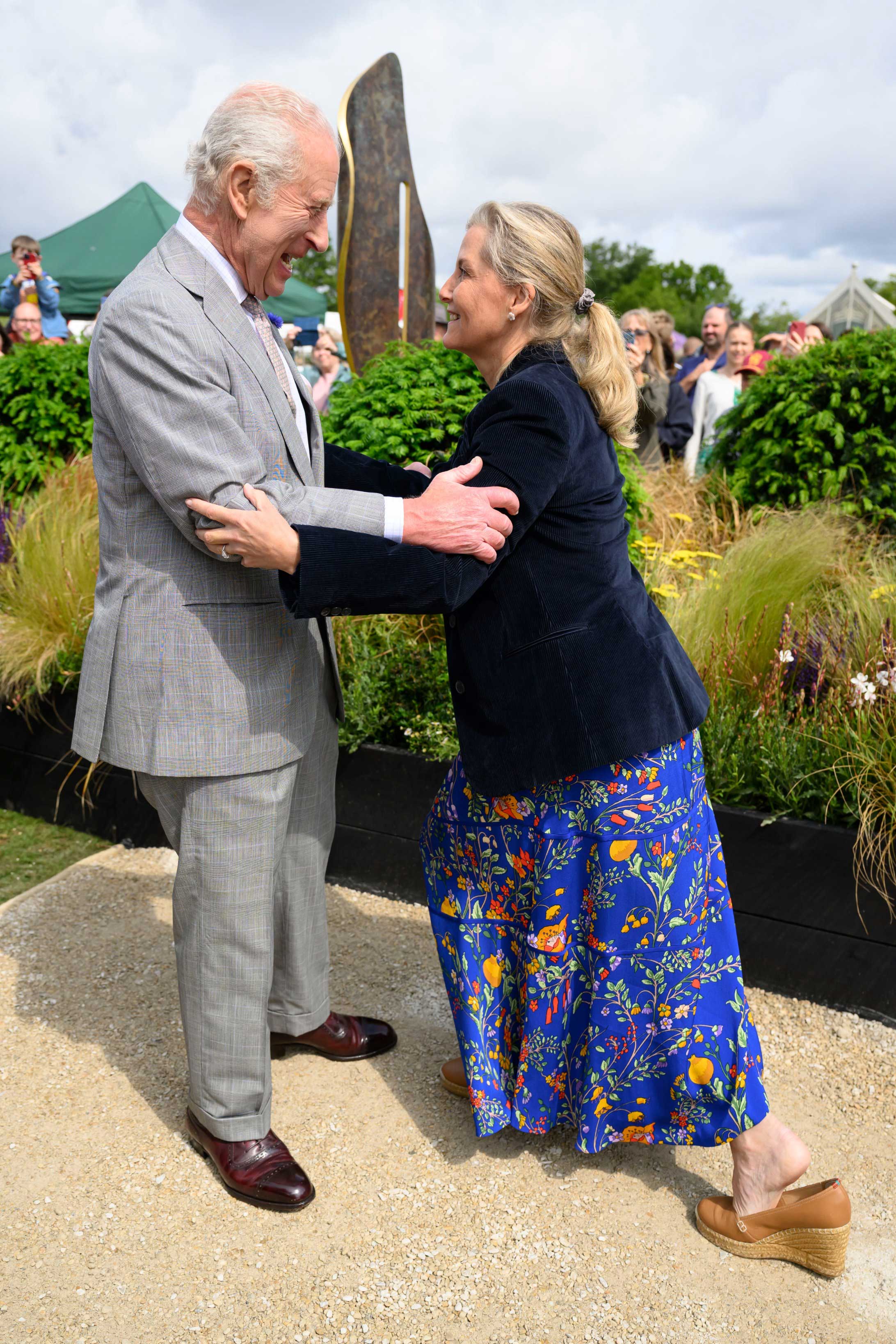 King Charles helps Sophie become steady after her footwear come loose