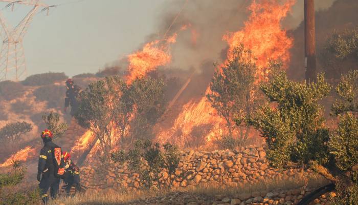 Greek island wildfire forces 1,500 to evacuate as heatwave intensifies