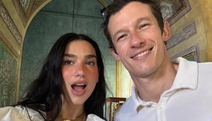Dua Lipa locks lips with Callum Turner for fiery kiss after Oasis concert date
