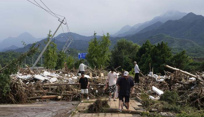 China floods death toll rises to 30 as heavy rains continue
