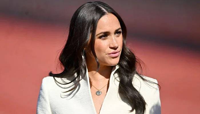 Meghan Markle enters car before Queen Elizabeth II