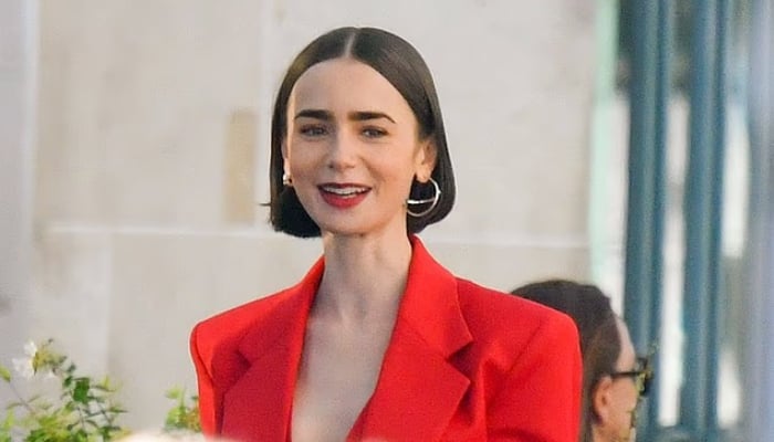 Lily Collins turns heads in bold red suit on Emily in Paris set