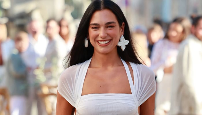 Dua Lipa soaks up sun and ‘vitamin sea’ in white after hit Sunny Hill Festival