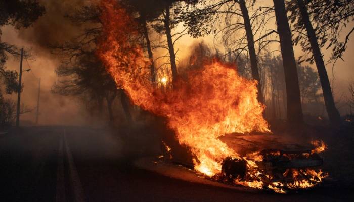 Deadly wildfire near Athens continues to rage as hundreds of firefighters battle blaze