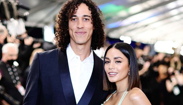 Vanessa Hudgens flaunts baby bump in nude dress during date with husband