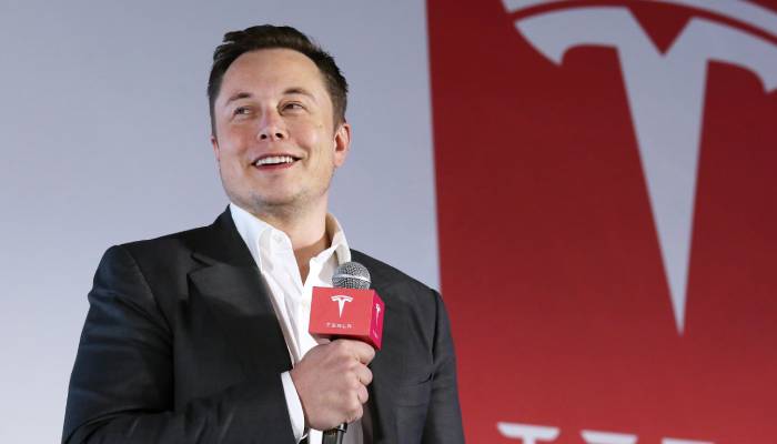 Elon Musk buys $1B Tesla shares as stock surges