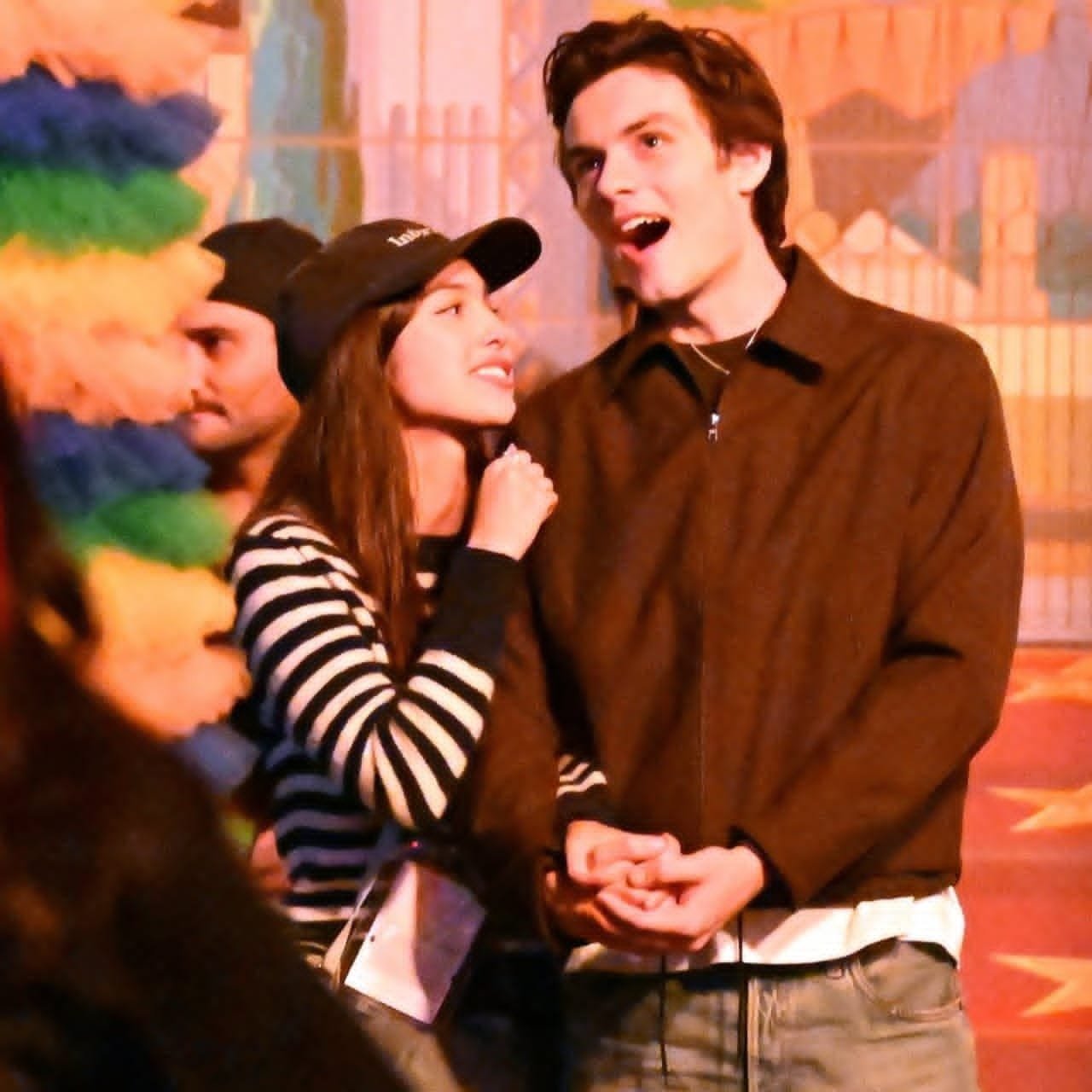 Olivia Rodrigo and Louis Partridge holding hands at Horror Nights in Hollywood