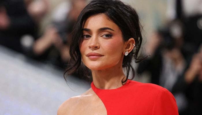 Kylie Jenner stuns fans in plunging black dress for Thanksgiving celebration