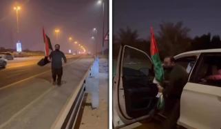 مصروف ترین شاہراہ پر گرا ہوا اماراتی جھنڈا اُٹھانے پر پاکستانی شہری توجہ کا مرکز بن گیا