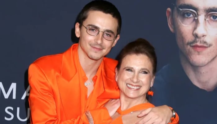 Timothée Chalamet twins with mom in bold orange at ‘Marty Supreme’ NYC premiere