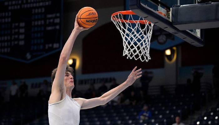 World’s tallest college basketball player Olivier Rioux breaks records with historic dunk