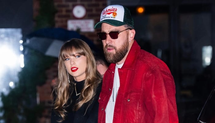 Taylor Swift, Travis Kelce share smiles during coach reunion