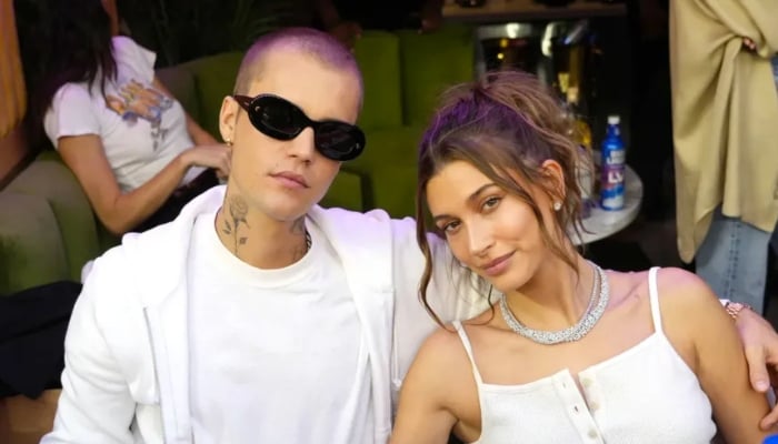 Justin Bieber, Hailey step out for holiday party amid marriage rumors