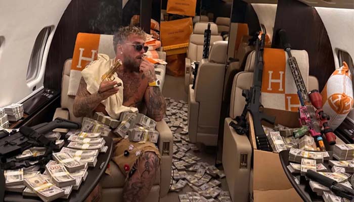 Jake Paul flaunts wealth, guns on private jet in post Joshua defeat stunt