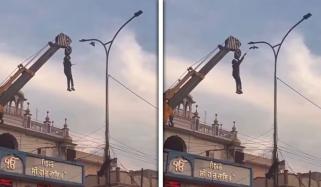 کرین سے لٹک کر پرندے کی جان بچانے والا شخص ہیرو بن گیا