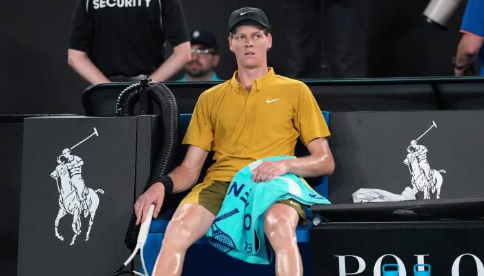 Sinner survives extreme conditions to keep Australian Open defense alive