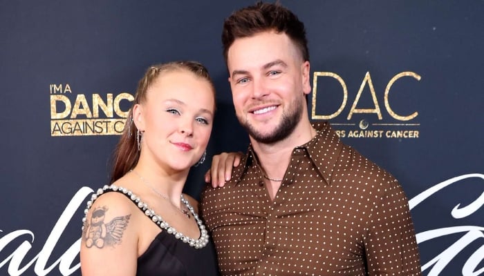 JoJo Siwa turns heads at brothers wedding with beau Chris Hughes