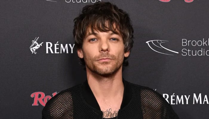 Louis Tomlinson dishes on One Direction songs he loved & hated