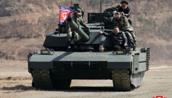 Kim Jong Un with his daughter in a new tank
