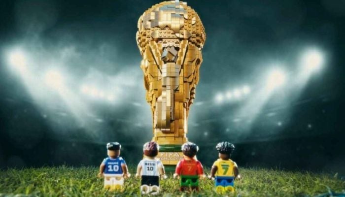 FIFA World Cup 2026 contenders Lionel Messi, Cristiano Ronaldo, Kylian Mbappé, and Vinícius Júnior, will be seen over a LEGO version of the trophy