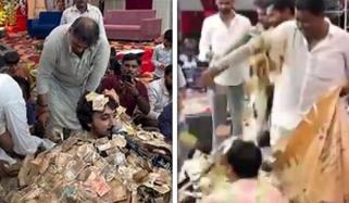 گجراتی لوک گلوکار پر نوٹوں کی بارش، گاتے گاتے پیسوں میں دب گئے