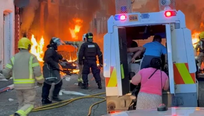 UK leaders urge calm as violent protests follow a Belfast stabbing