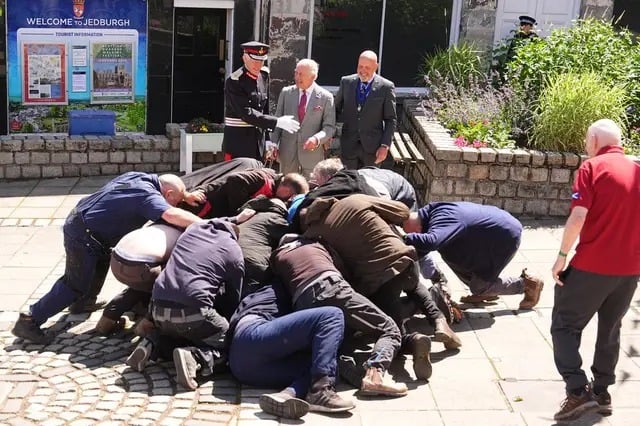King Charles keeps composure as security responds to tense public moment