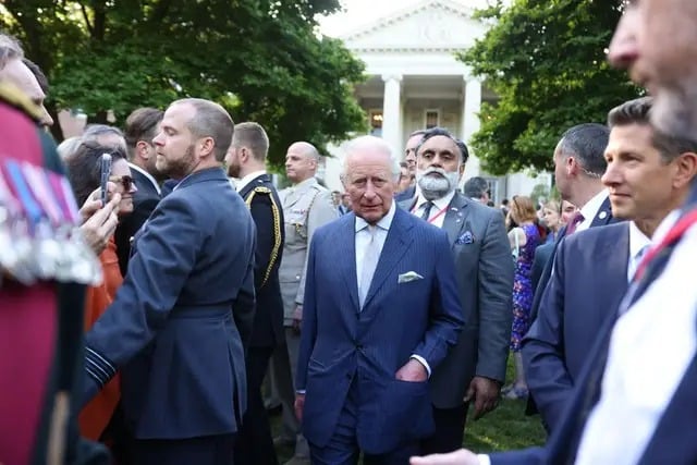 King Charles keeps composure as security responds to tense public moment