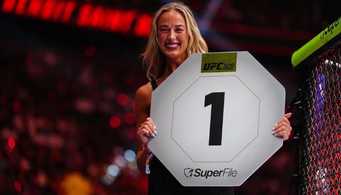 WNBA star Sophie Cunningham stuns as surprise ring girl at UFC 329