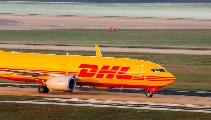 Boeing 737 DHL cargo plane erupts in flames at LAX Airport
