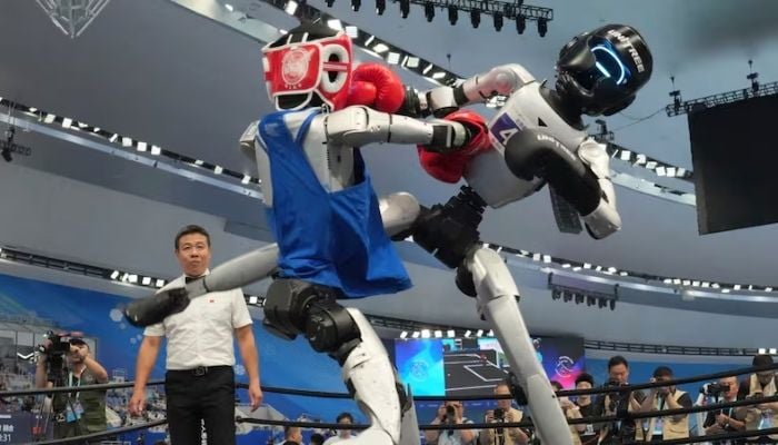 Humanoid robot nearly crashes into camera crew at Beijing games